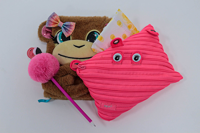 Kids notebook, pen, and pencil case, with a pad.