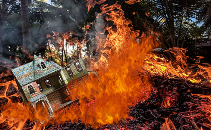 Burning dollhouse in a burning forest